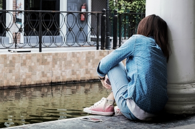 teen girl sitting alone practicing mindfulness