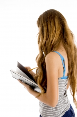 Teen girl alone holding books