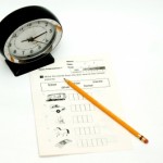 clock, pencil, test all indicate stressful, timed test at school