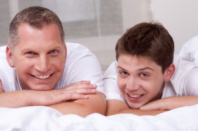 Improving relationships with our teens is possible. Smiling father and son. Image courtesy of photostock at FreeDigitalPhotos.net