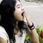 Image of tired teen girl yawning