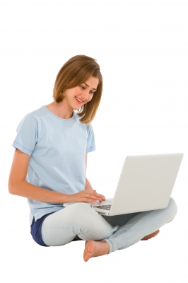 Social media addicted teen girl on laptop