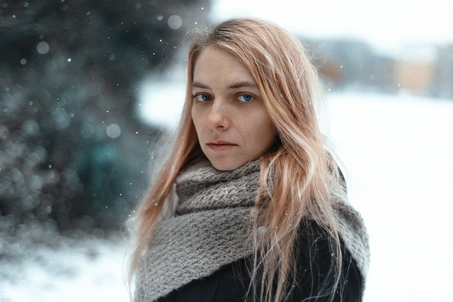 Adolescent girl standing in snow