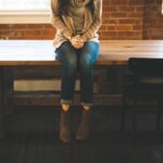 teen girl with agoraphobia sitting alone on bench.